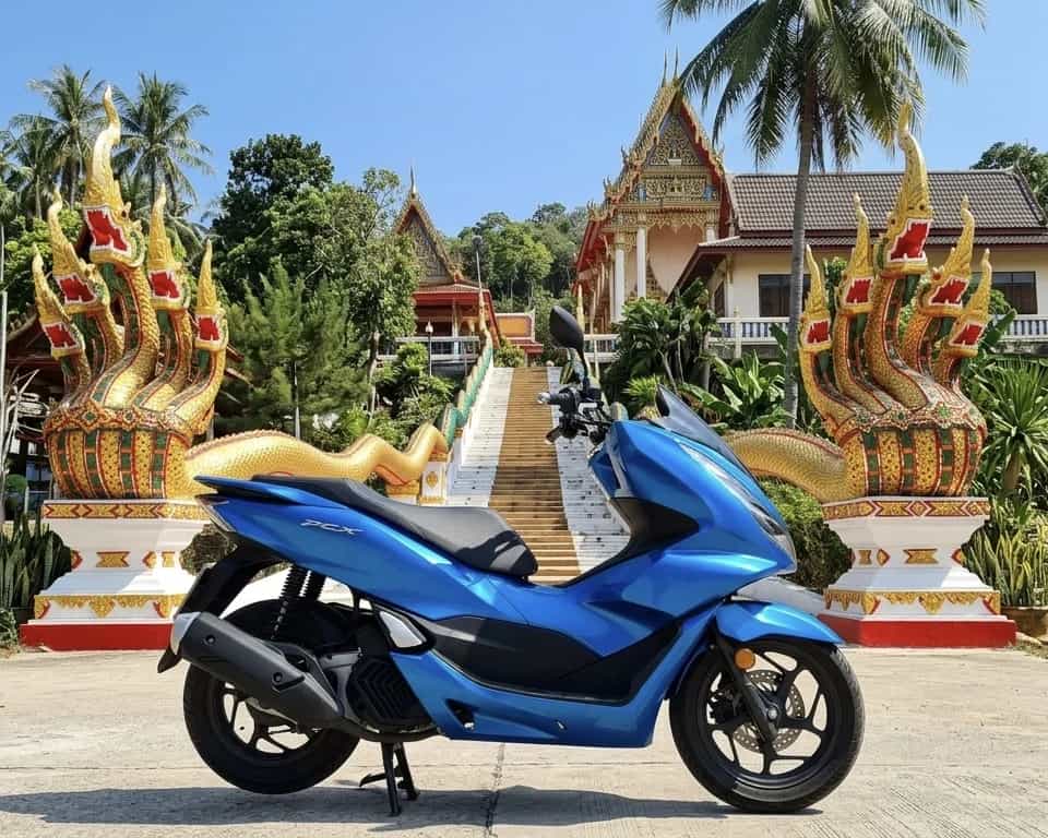 Honda PCX scooter at a Lanna temple naga staircase on Koh Phangan, Thailand: Byklo scooter rental (coming soon)